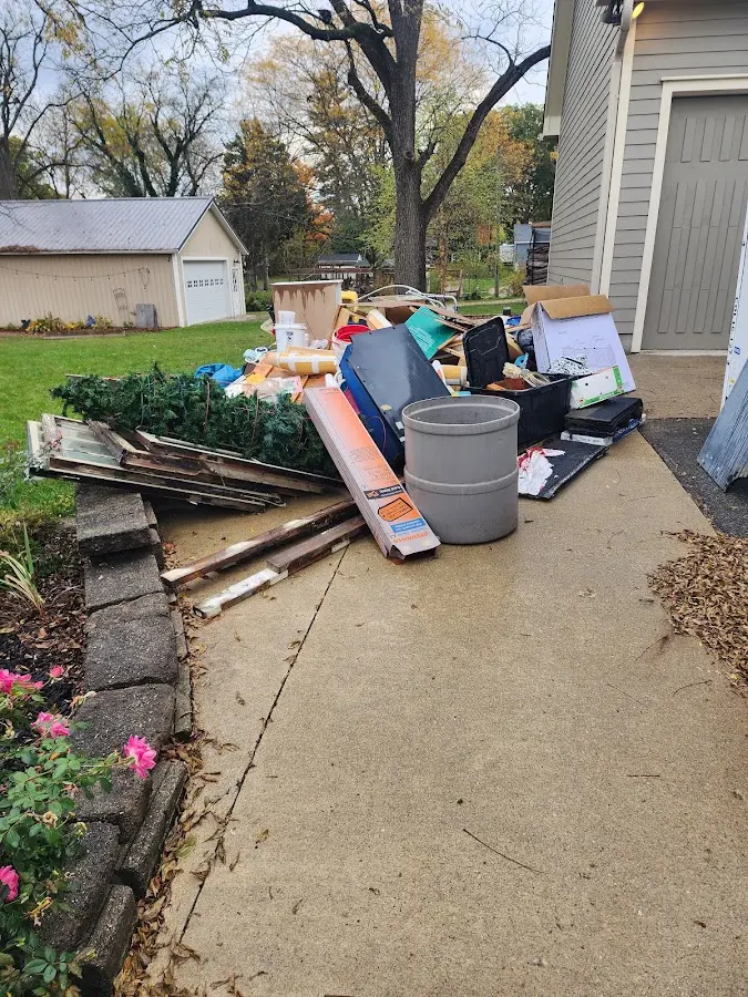 Dumpster being loaded with debris for 30 Yard Dumpster Rental in The Homesteads